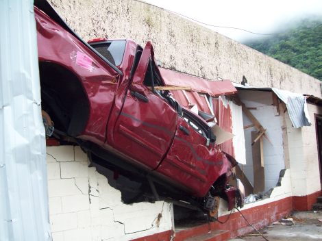 Car flattened into the building