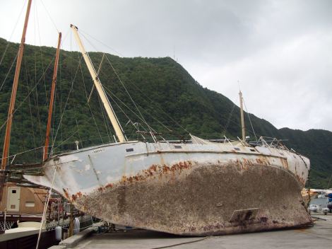 Family living underneath this stranded yacht.