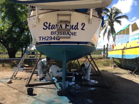 Luke and Russi helping sand the yacht