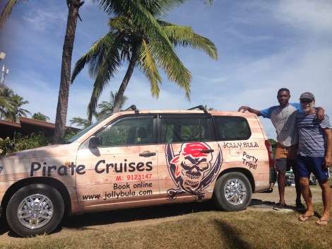 Frank & Tai in front of the Jolly Bula car