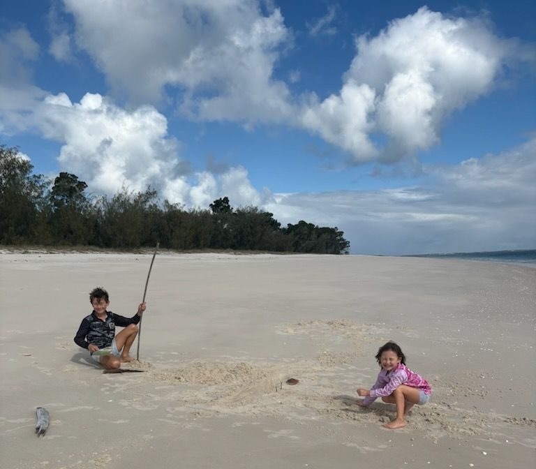 Max & Mika playing on the beach at Moon Pt